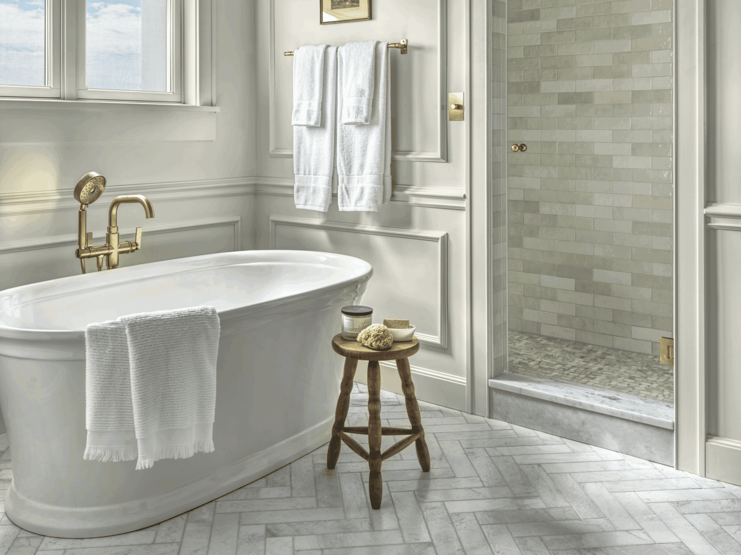 Primary bathroom remodel in St. Charles, featuring a freestanding tub and custom arched tiled shower.