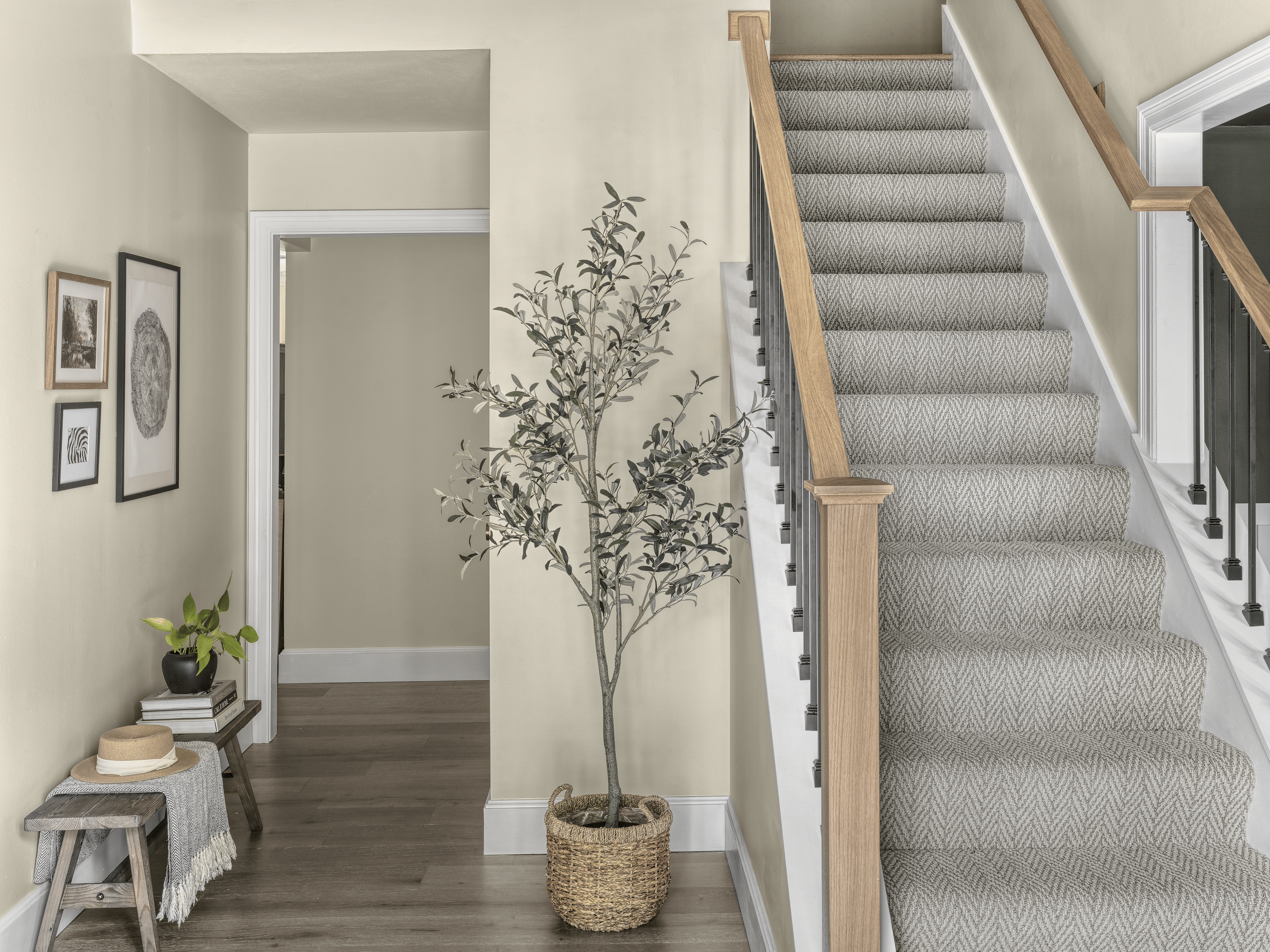 Entryway custom staircase showing custom carpentry by a residential general contractor in St. Charles, MO.