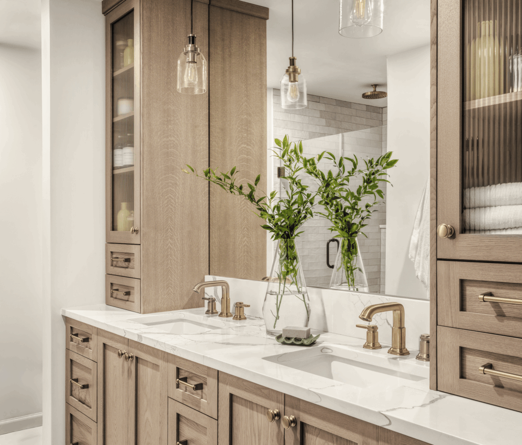 Luxury bathroom renovation on Greenleaf Drive in St. Louis featuring a white oak double sink vanity with marble countertops.